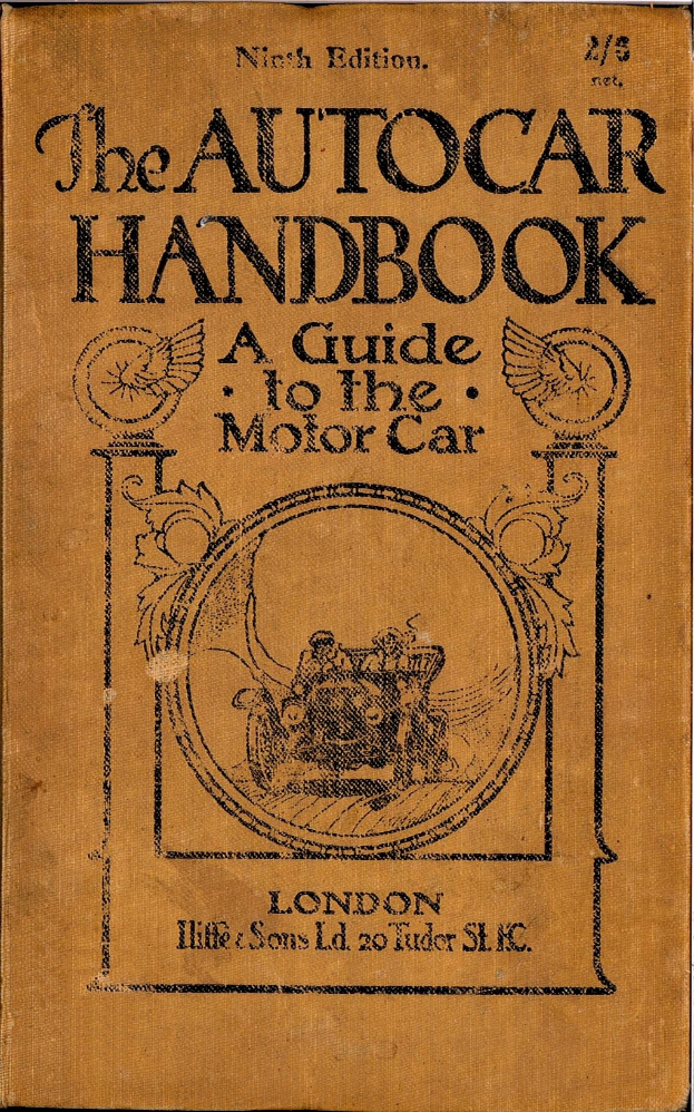 Altes Buch mit dem Titel "The Autocar Handbook: A Guide to the Motor Car" mit einem hellblauen Einband und weißer Schrift, das Spuren von Abnutzung auf einer weißen Oberfläche zeigt.