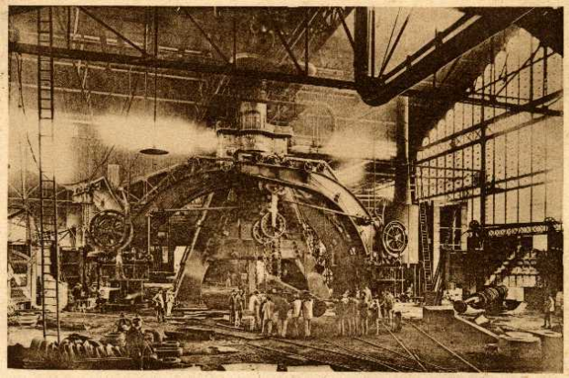 Ein Schwarz-Weiß-Foto einer Fabrikszene in der Cadillac Steel Works, bei der Arbeiter eine große Maschine bedienen, umgeben von Leitern und Stangen.