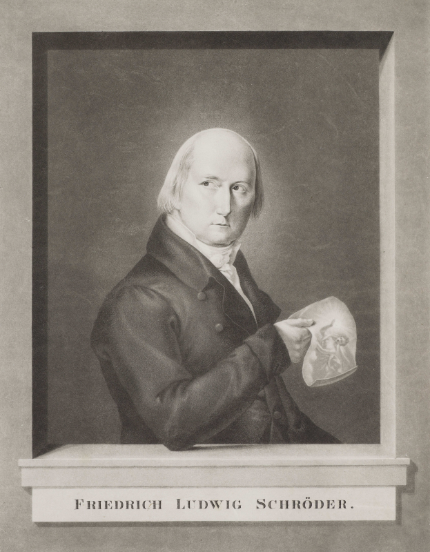 Ein Schwarz-Wei-Foto von Friedrich Ludwig Schr├Âder, einem deutschen Komponisten, der einen Anzug tr├Ągt und ein Blatt Papier h├Ąlt, mit einem ernsten Gesichtsausdruck und konzentriertem Blick.