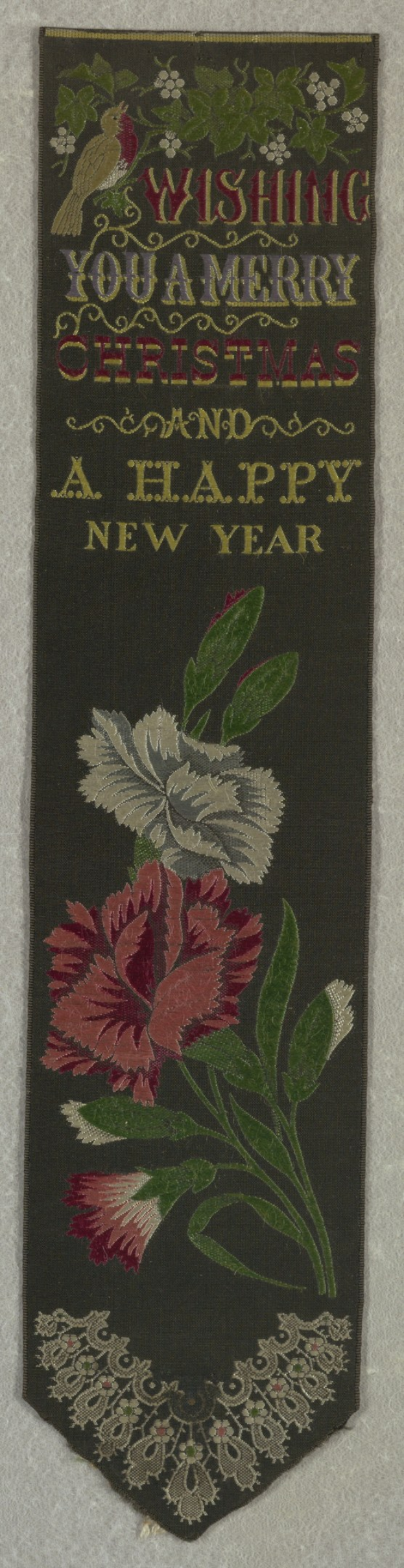 Schwarze Flagge mit roter und wei├čer Blumenstickerei, die 'Frohe Weihnachten und ein glückliches neues Jahr' lautet, umgeben von bunten Blumen und Bl├Ąttern.
